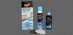 The components of a Meguiar's® Two Step Headlight Restoration Kit including the pads, a bottle and a canister, along with the box.